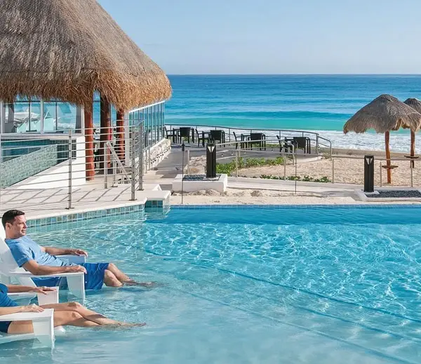 Lovely young romantic couple relaxing by the pool