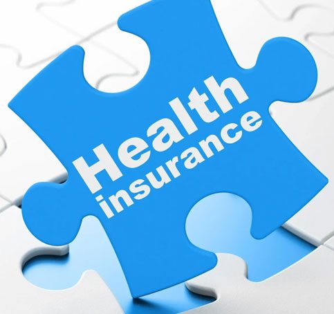 Health insurance on blue puzzle pieces background